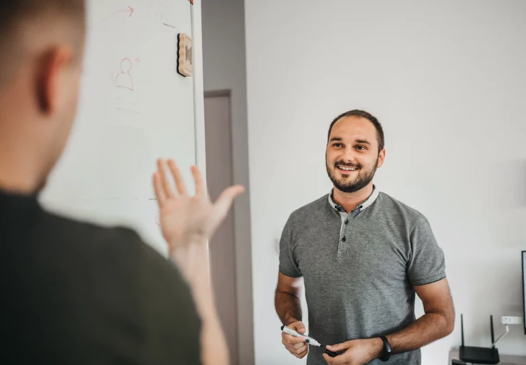 Two men role playing to simulate asking for donations