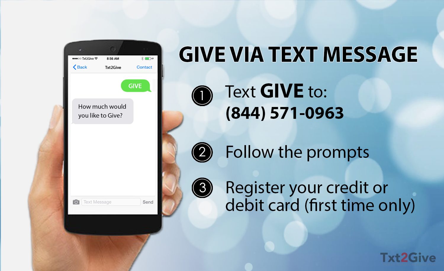 Hand holding a cell phone showing text giving campaign